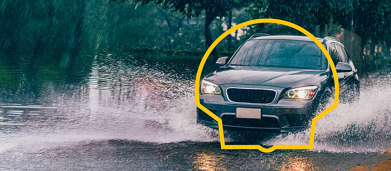 Pascal Feindouno holding a bottle of lubricant with the gas station attendant
